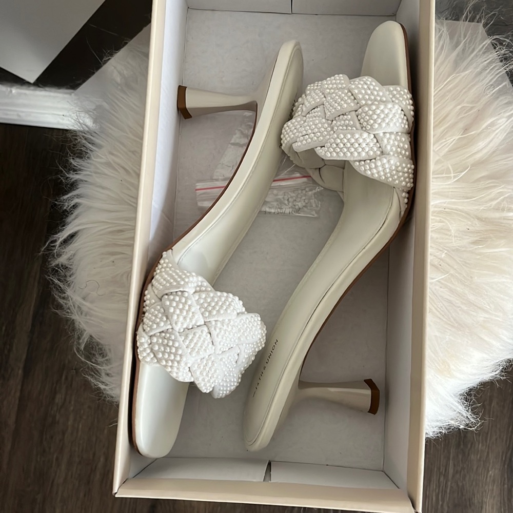 Off white mules with pearl and braid detail